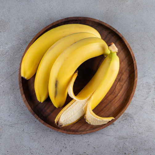 bunch-juicy-yellow-banana-placed-stone-table